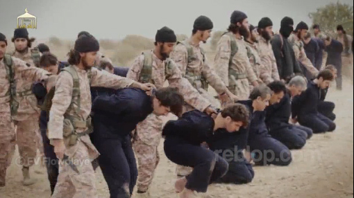 ISIS recruits prepare to behead 19 captured Syrian pilots and military officers in a ritualistic ceremony. This marks their formal induction into the ranks of the jihadis through the shedding of blood.