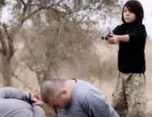 The boy shoots the captives in the head, then fires more rounds into them